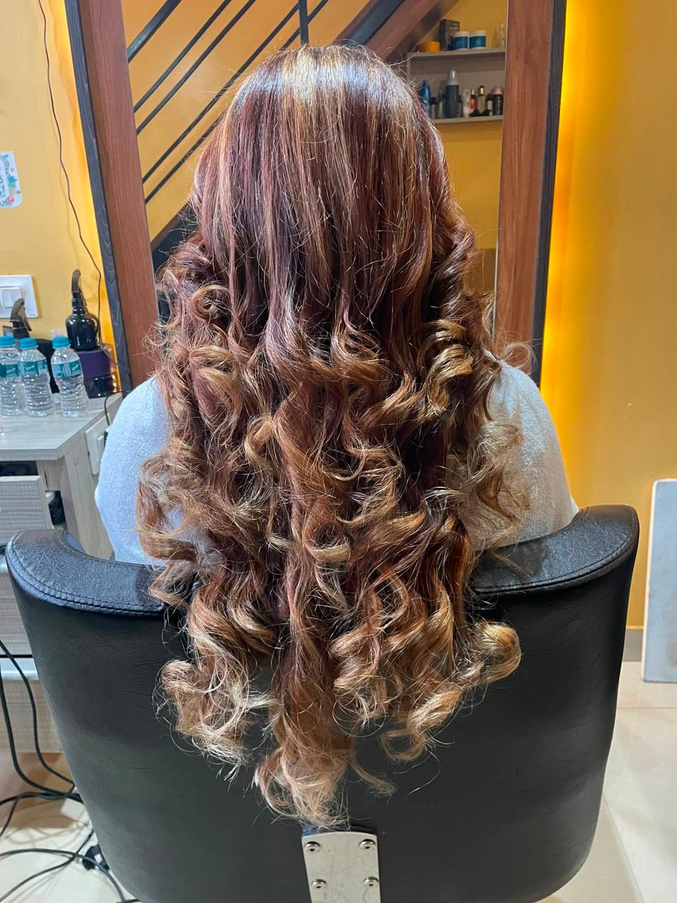 Long curls with caramel highlights