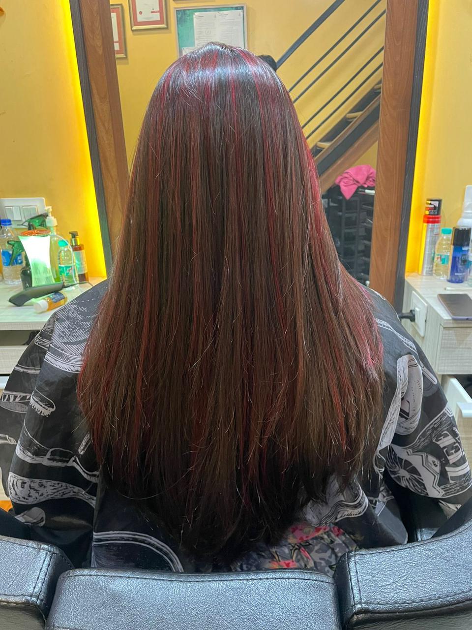 Rich red highlights on long hair